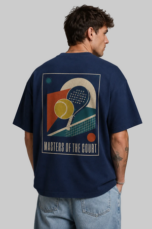 Person wearing a navy blue t-shirt with a graphic design and text on the back, standing against a gray background.