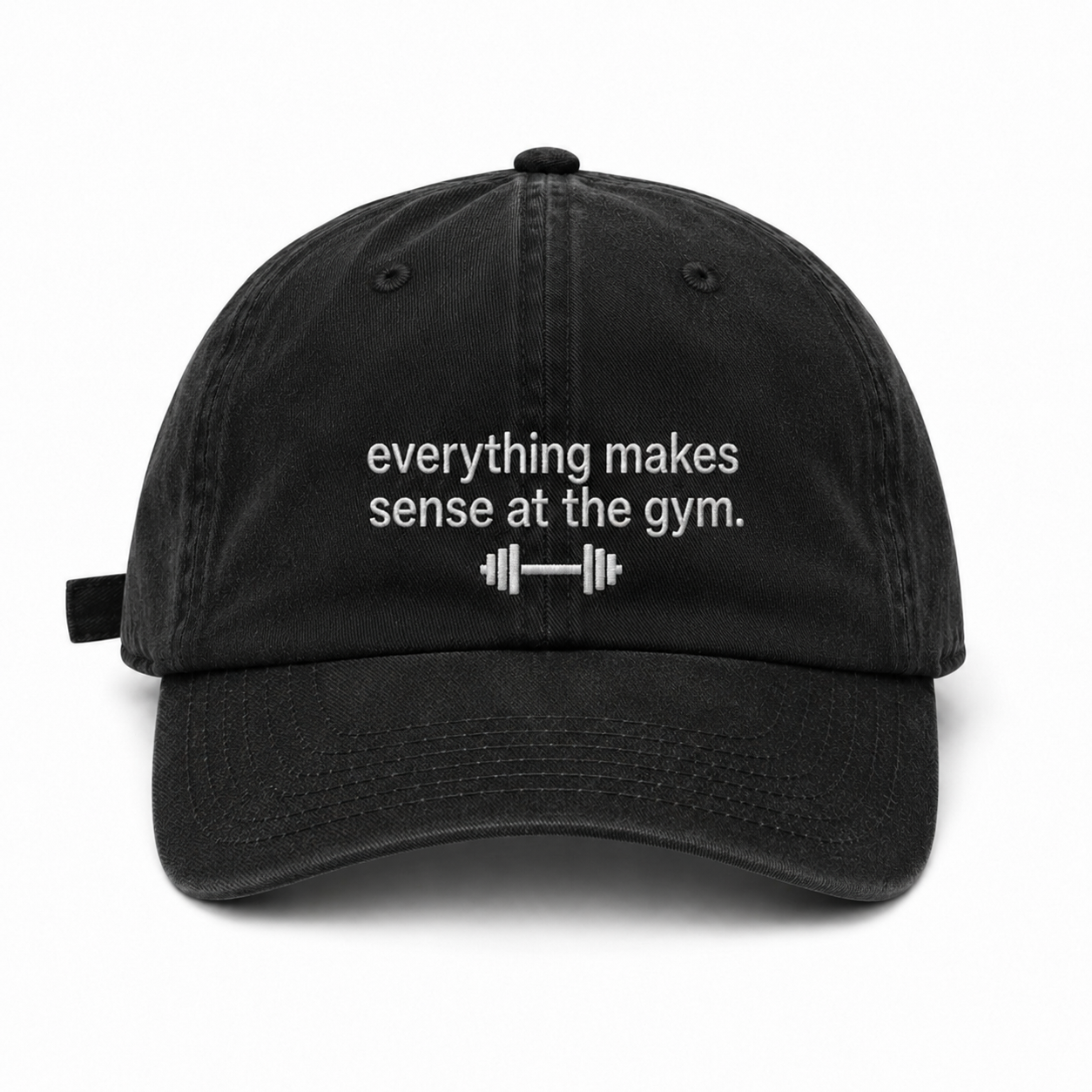 A black cotton baseball cap with white embroidered text reading 'everything makes sense at the gym.' and a small barbell graphic below, shown on a plain white background.